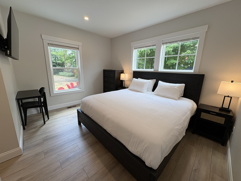 Luxury king bedroom with en-suite bathroom and TV