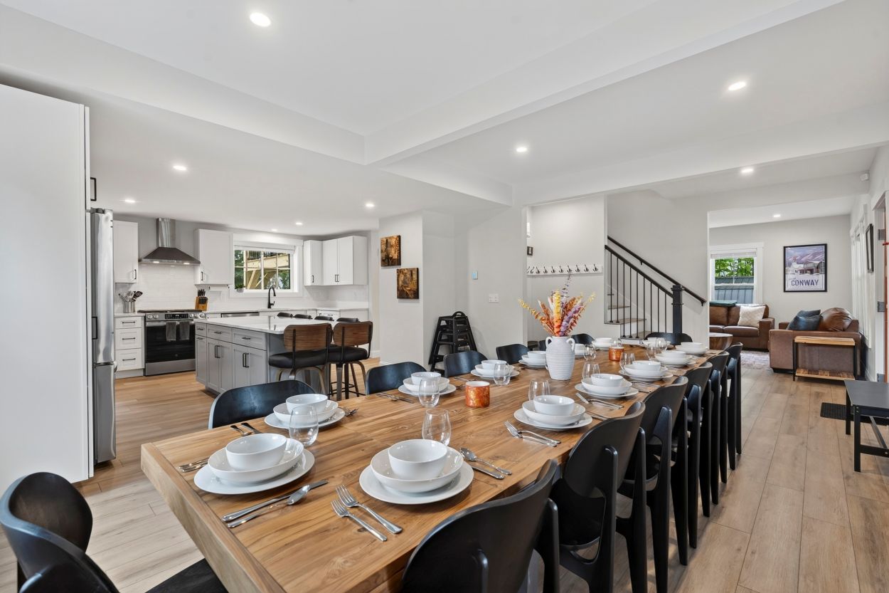 Luxury open-concept kitchen with quartzite island and oversized kitchen table