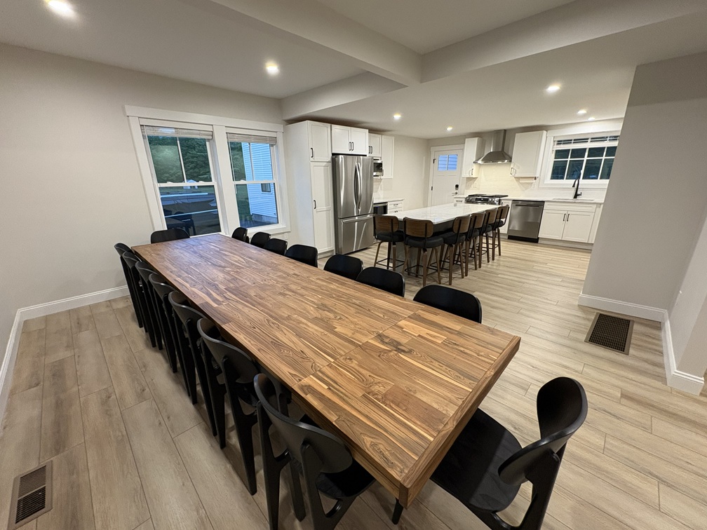 Open-concept kitchen with quartzite island and oversized kitchen table